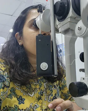 Dr. Anyatama Bhuiyan at the slit-lamp microscope